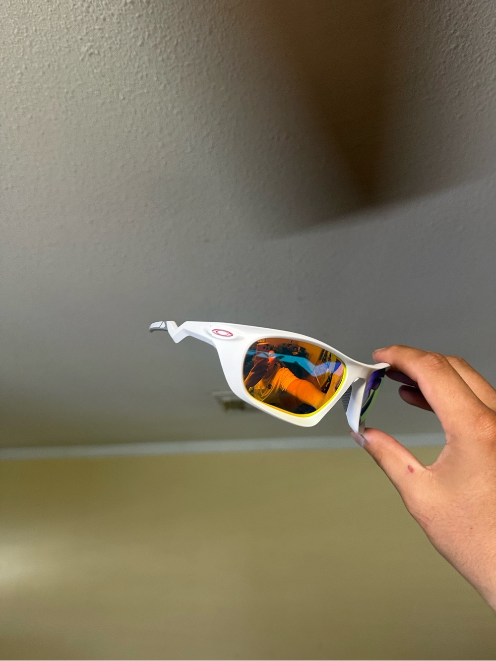 Oakley White Frame Sunglasses with Orange Mirrored Lenses
